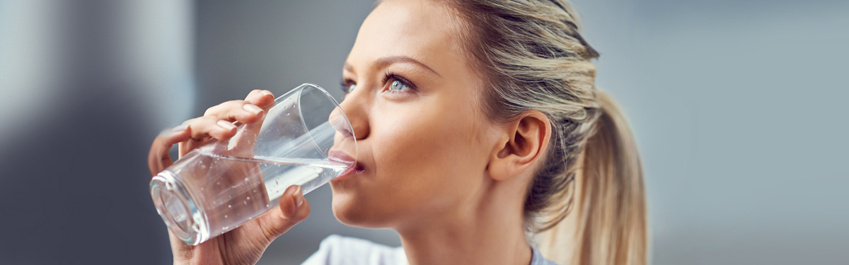 Woman drinking purified water
